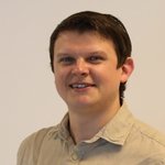 Unterpustertal/Gadertal Porträt eines lächelnden Mannes vor weißem Hintergrund