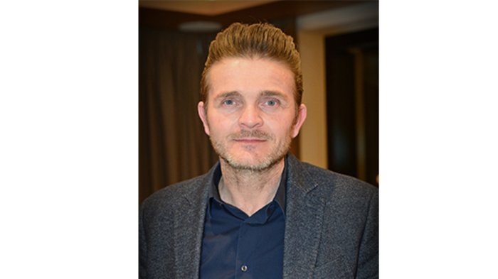 2021: Chancen und Perspektiven für das Handwerk Porträt eines Mannes mit kurzen braunen Haaren im Blazer