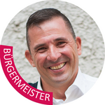 Unterland Porträt eines lächelnden Mannes mit dem Schriftzug Bürgermeister