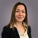 Das lvh-Team Porträt einer lächelnden Frau mit braunen Haaren in Bluse und Blazer