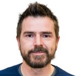 Bozen Land Porträt eines Mannes mit kurzem braunem Haar und Bart vor weißem Hintergrund