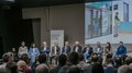 Anlaufstelle für Künstliche Intelligenz vorgestellt Podiumsdiskussion bei Competence Network AI Südtirol mit vollbesetztem Publikum