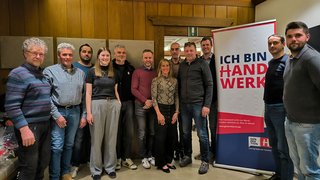 News Gruppe von Personen vor einem Banner mit Aufschrift Ich bin Handwerk